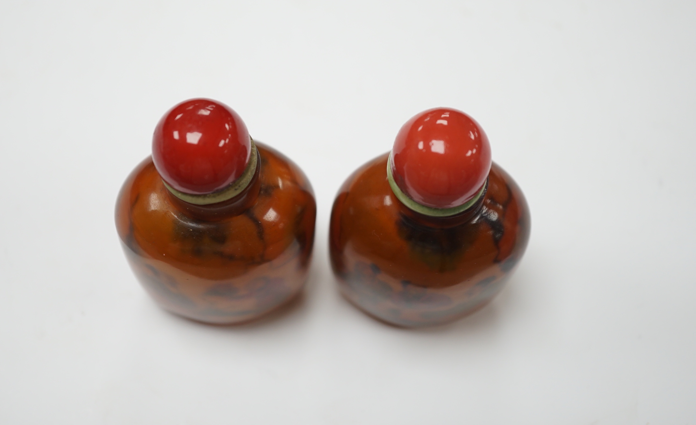 Two Chinese glass snuff bottles, internally painted with figures, 8cm high